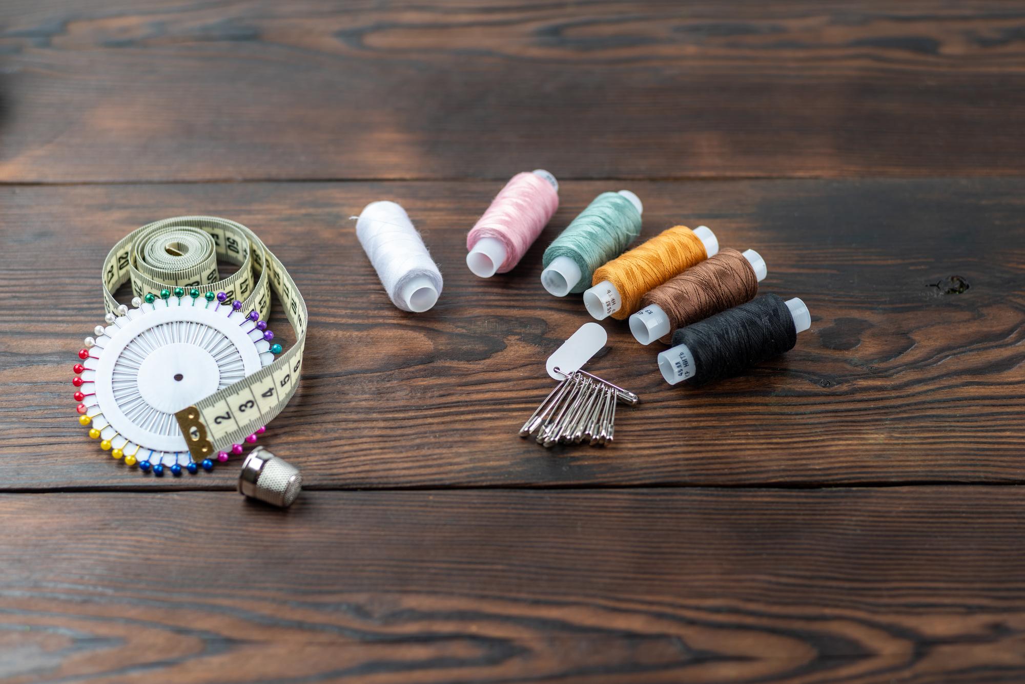 selection of threads and embroidery tools